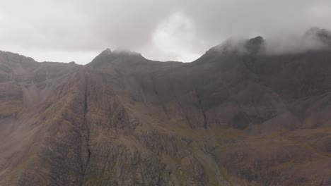 drone shot of majestic tall mountains in isle of skye scotland