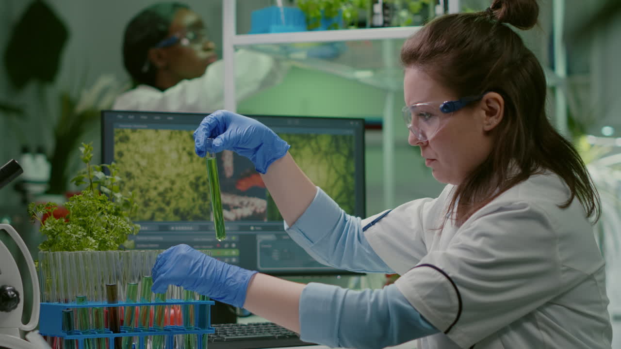 Biochemistry doctor examining chemical test under microscope
