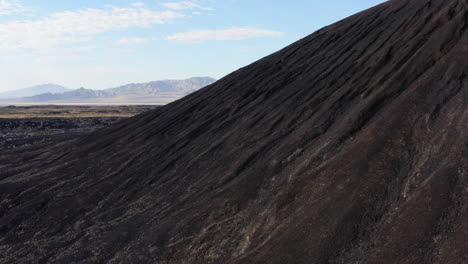 rotating aerial view of the outside of the large volcanic amboy crater