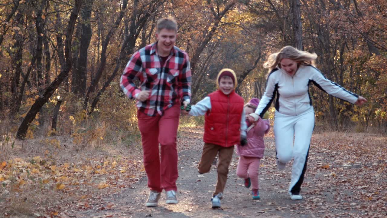 Family enjoying an autumn walk in the park