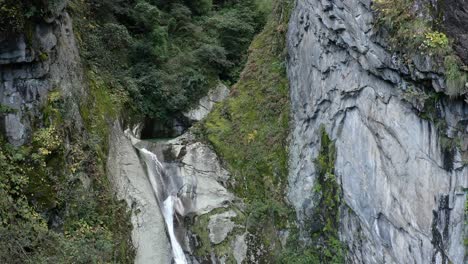 waterfall cascading over mount cangshan mountainside, china, aerial view