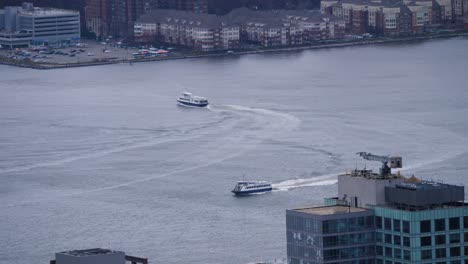 boats moving on hudson river from above during windy day in new york