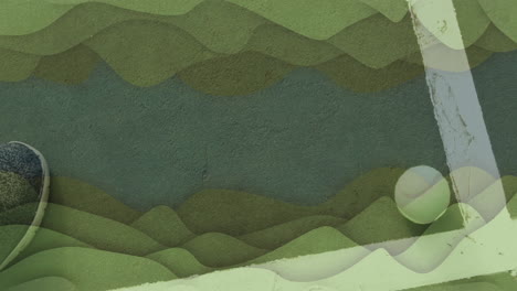 tennis ball resting near boundary line, highlighting textured green court surface with shoe tip