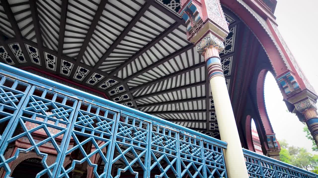 Panning and contemplative shot of the side façade of the iconic Moorish Kiosk in the popular Santa María la Ribera neighborhood of Mexico City