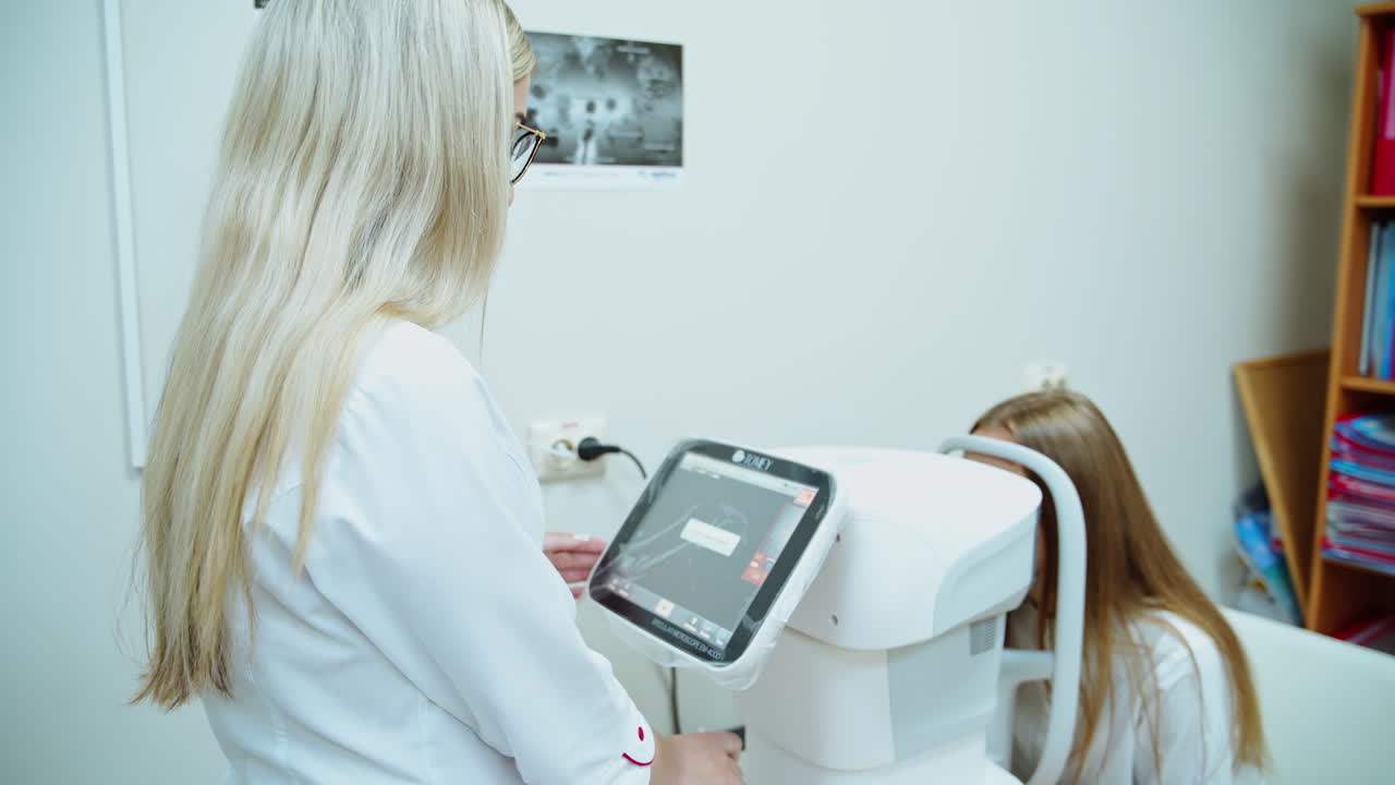 Working with medical devices for eye health. Eye health cheking with ophthalmological equipment in the laboratory