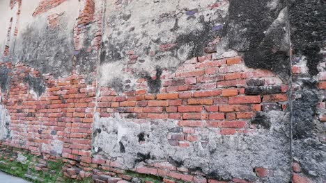 aged brick wall with visible wear and tear