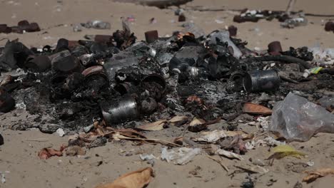 household garbage burned out in sand dunes