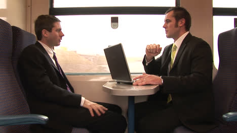 businessman working on a train