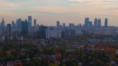 downtown warsaw poland skyscrapers and towers in autumn twilight, aerial view of central buildings from old town