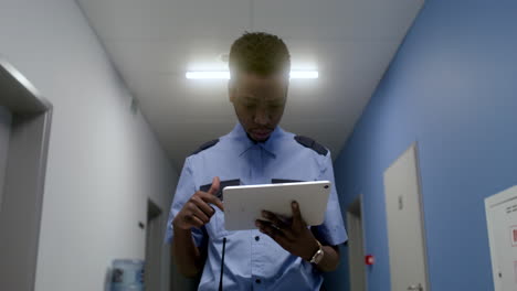 man in uniform working in the corridor