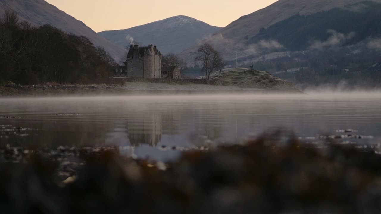The Old Castle Of Dunderave Situated On The Coastline Of Loch Fyne In Argyll and Bute, Highlands of Scotland. -wide shot