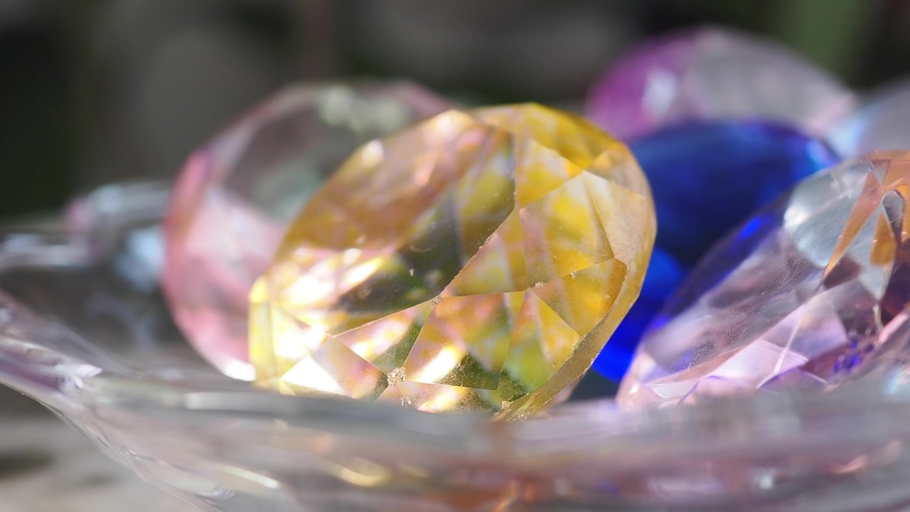 Close-up of Colorful Decorative Gemstones in a Glass Bowl