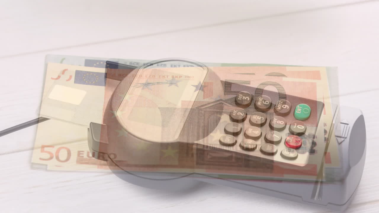 ユーロ紙幣が決済端末の上に落ちるアニメーション