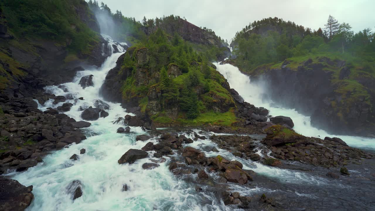 Scenic Latefossen twin waterfall, Norway. Idyllic cascade in Scandinavia nature, lush green landscape.