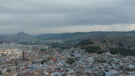 Aerial-views-with-drone-over-the-monumental-city-of-southern-Andalusia-in-Antequera,-Málaga,-views-of-its-castle-and-monumental-area-of-said-world-heritage-city