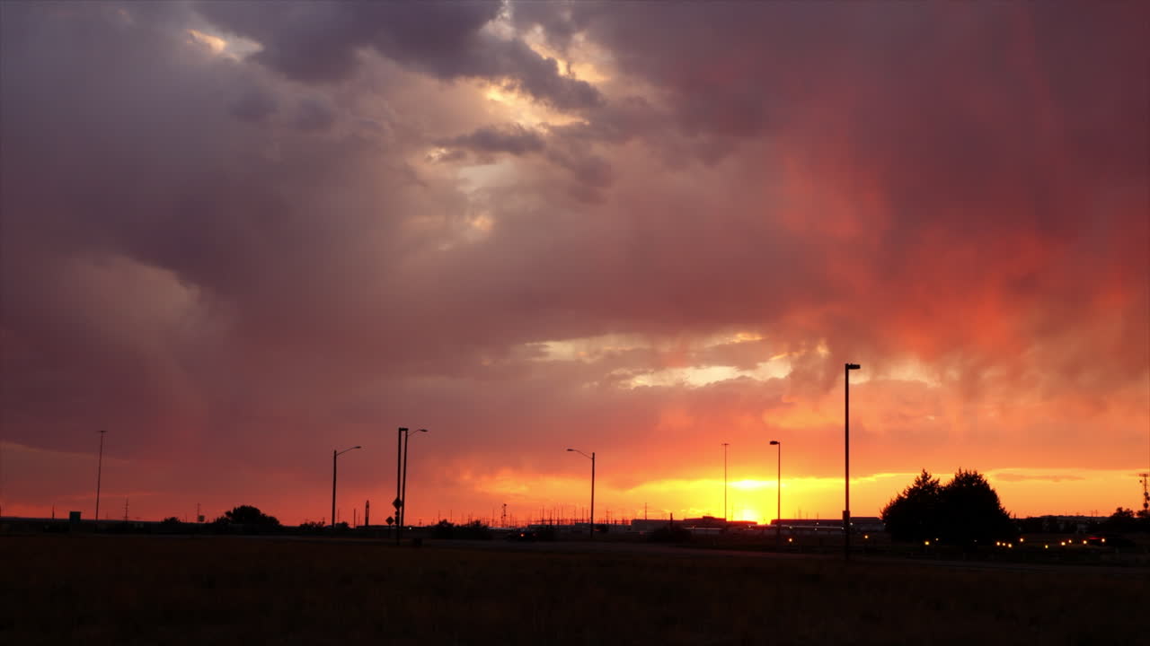 As the sun sets, storm clouds form and drop precipitation.