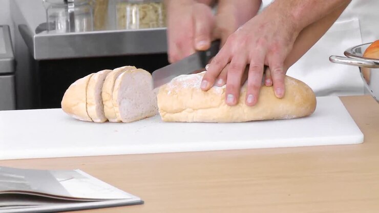 Close up of bread being cut