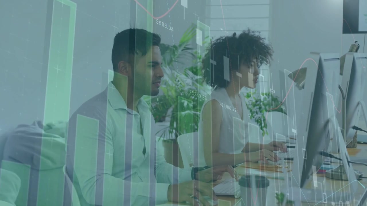 Man leaning and glancing toward coworker, woman typing, green charts scrolling illustrating data