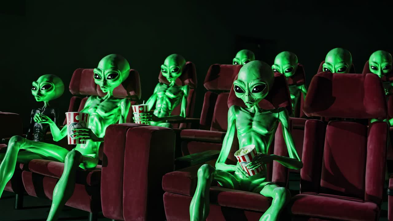 Green alien characters lounging together, enjoying movie snacks in darkened theater, presenting whimsical sci fi entertainment scenario with playful extraterrestrial group gathering