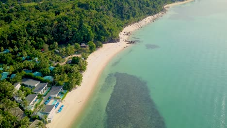 4k aerial front view of surin beach, phuket