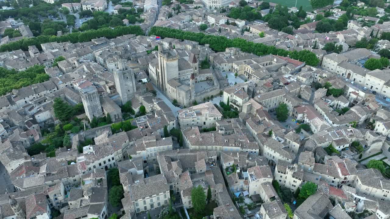 Aerial circling Duche Palace in medieval town of Uzes, France