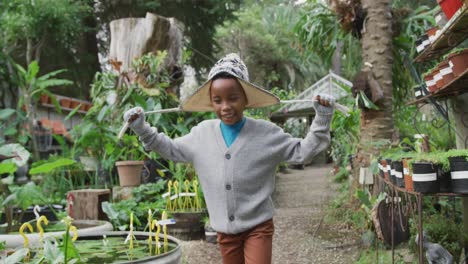 Happy-african-american-boy-running-and-playing-in-garden