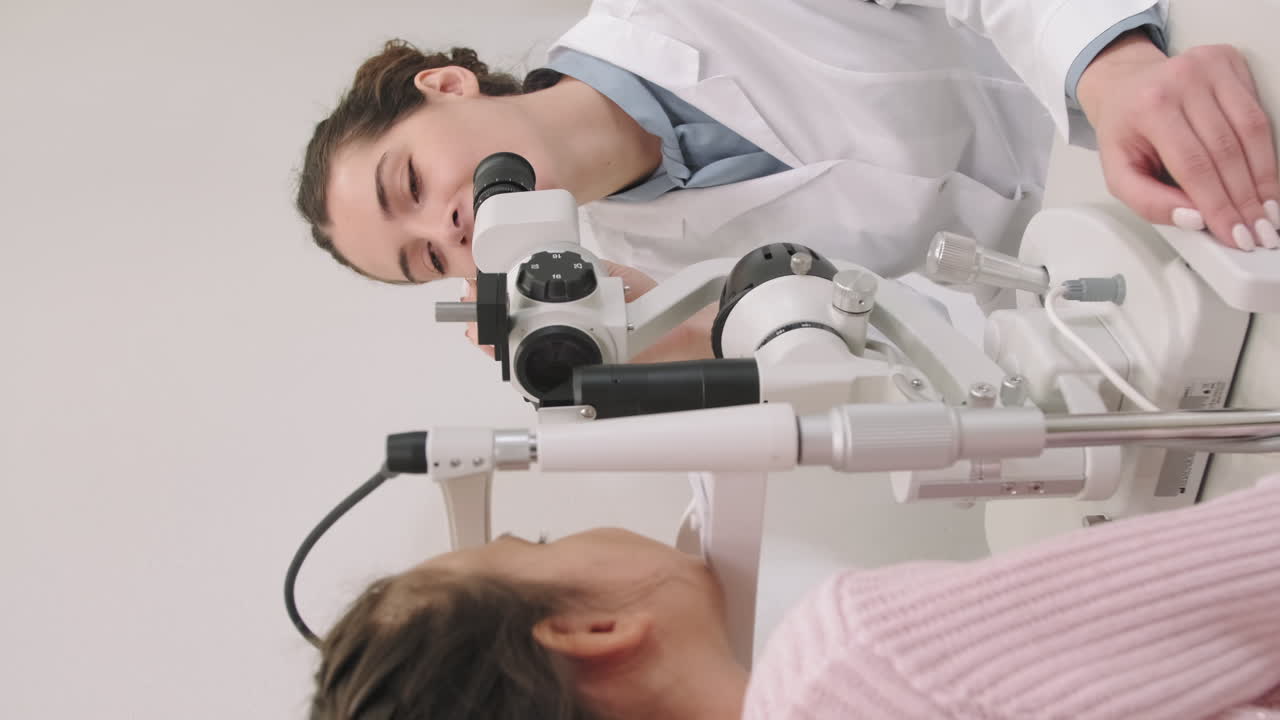 Female Ophthalmologist Doing Eye Test In Clinic