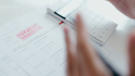 person, hands and calculator with documents