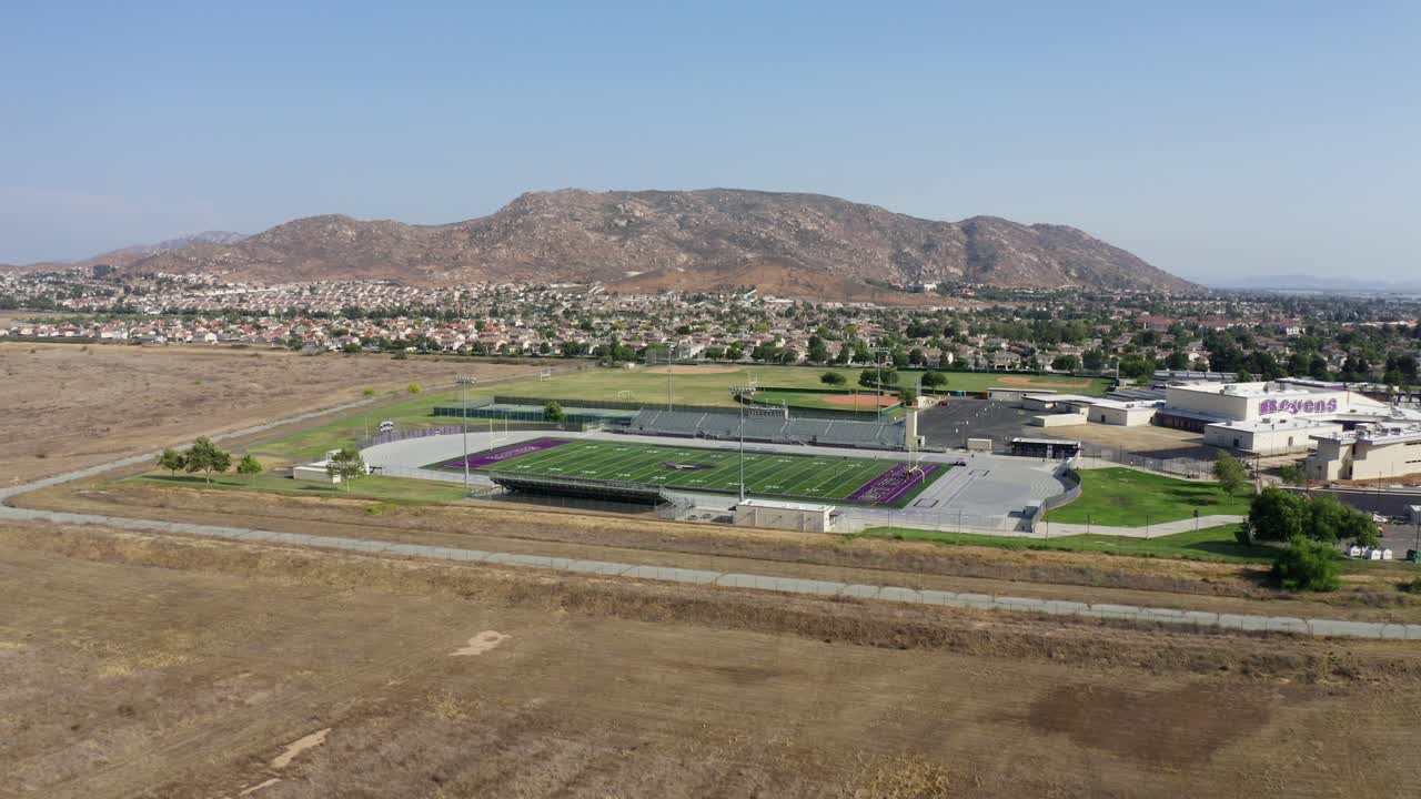Drone shot of a football field in Moreno Valley, California, in the desert.