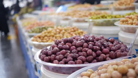 fresh olives on display at a market stall