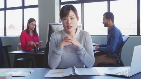 Businesswoman-interviewing-someone-in-modern-office