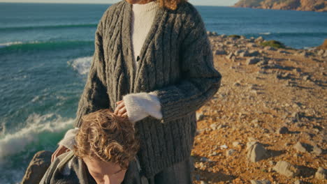 tender girl caressing man at sea horizon closeup. loving couple romantic date