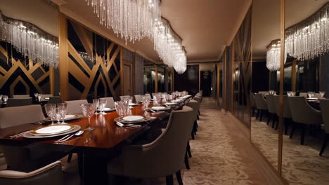 luxurious empty dining room with chandeliers and long table