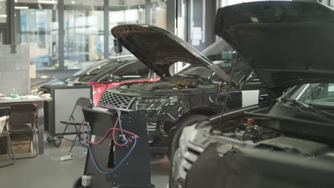 cars undergoing maintenance in auto repair shop