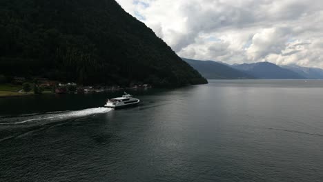 norwegian ferry transporting passengers between docks in the beautiful fjord