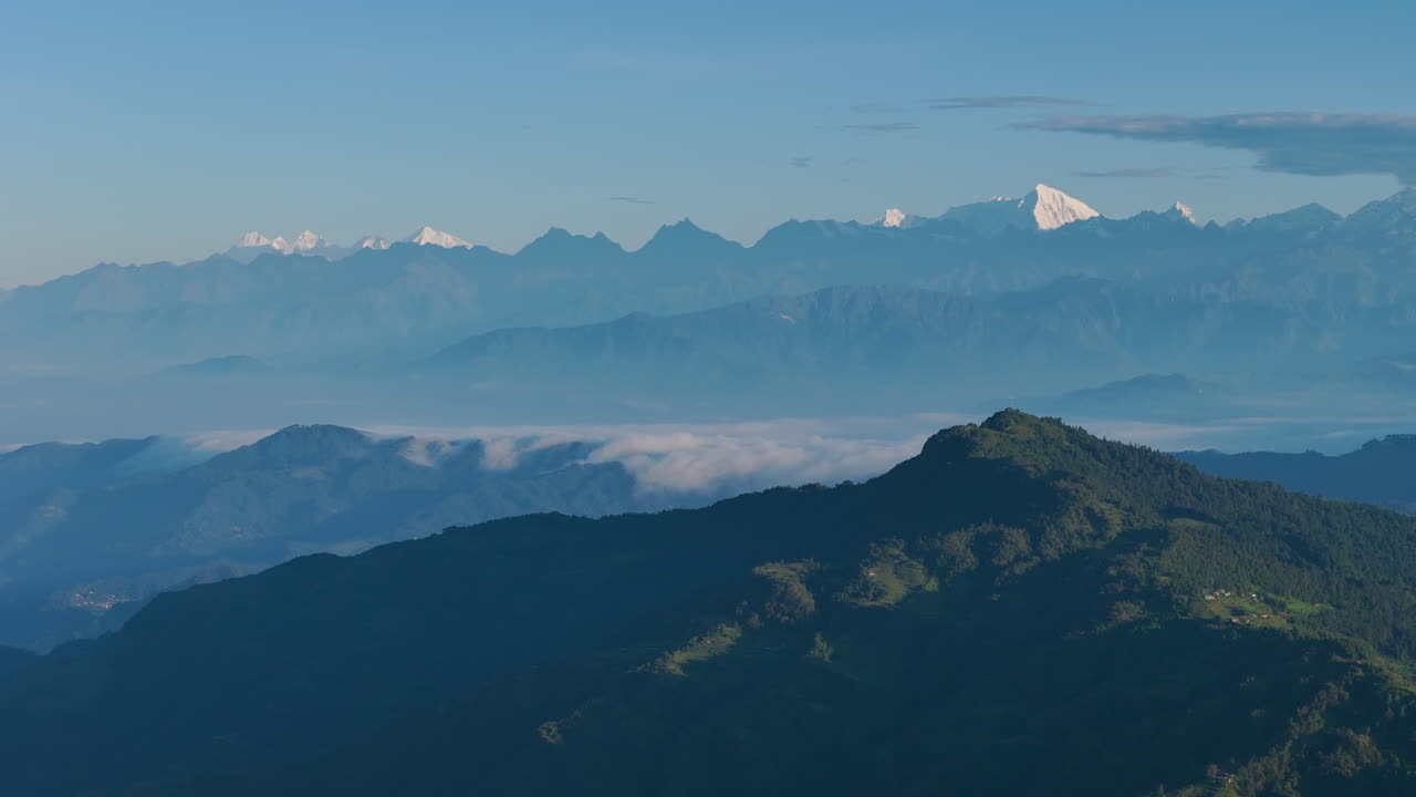 Panning drone shot captures green hills forests mountain landscape of Nepal Dolakha Sailung near Tibet horizon and heaven-like atmosphere, shows cinematic beauty for nature lovers and travelers