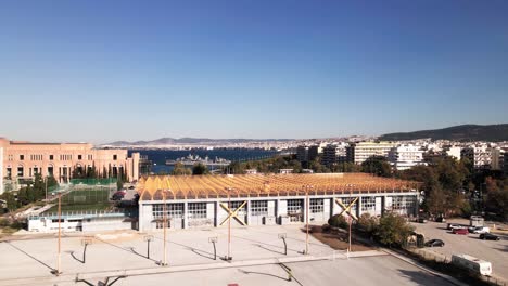 4K-drone-clip-ratating-over-baskteball-court-in-a-sports-complex-in-Thessaloniki,-Greece