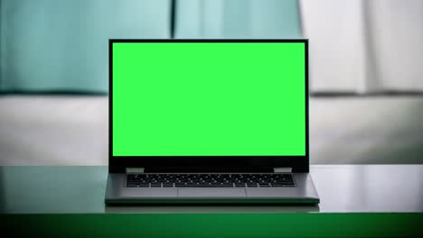 working in the evening. laptop with green screen. zoom in. template for keying