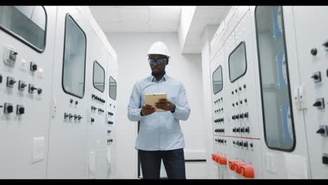 engineer working on control panel in power plant