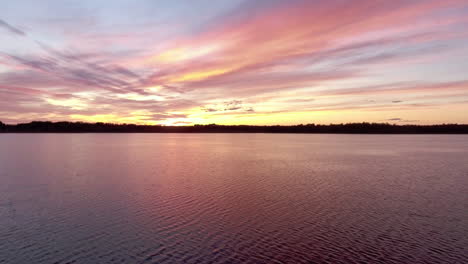 Aerial-Over-Beautiful-Lake-At-Sunset