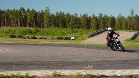 street motorbike rider on training track, turning right in slow motion