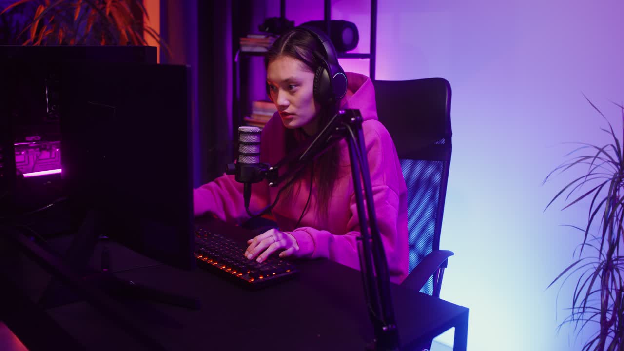 Woman Gaming with Headphones and Microphone