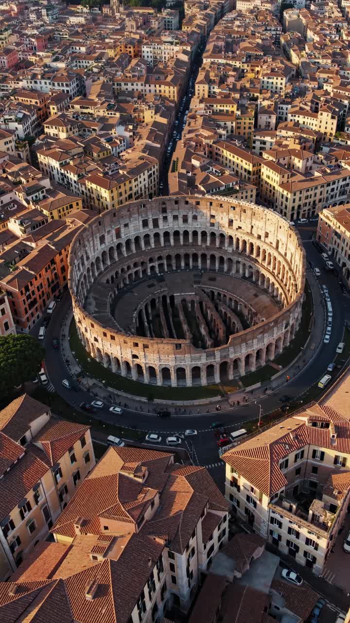 Aerial video captures a stunning top-down view of a historic amphitheater surrounded by a densely