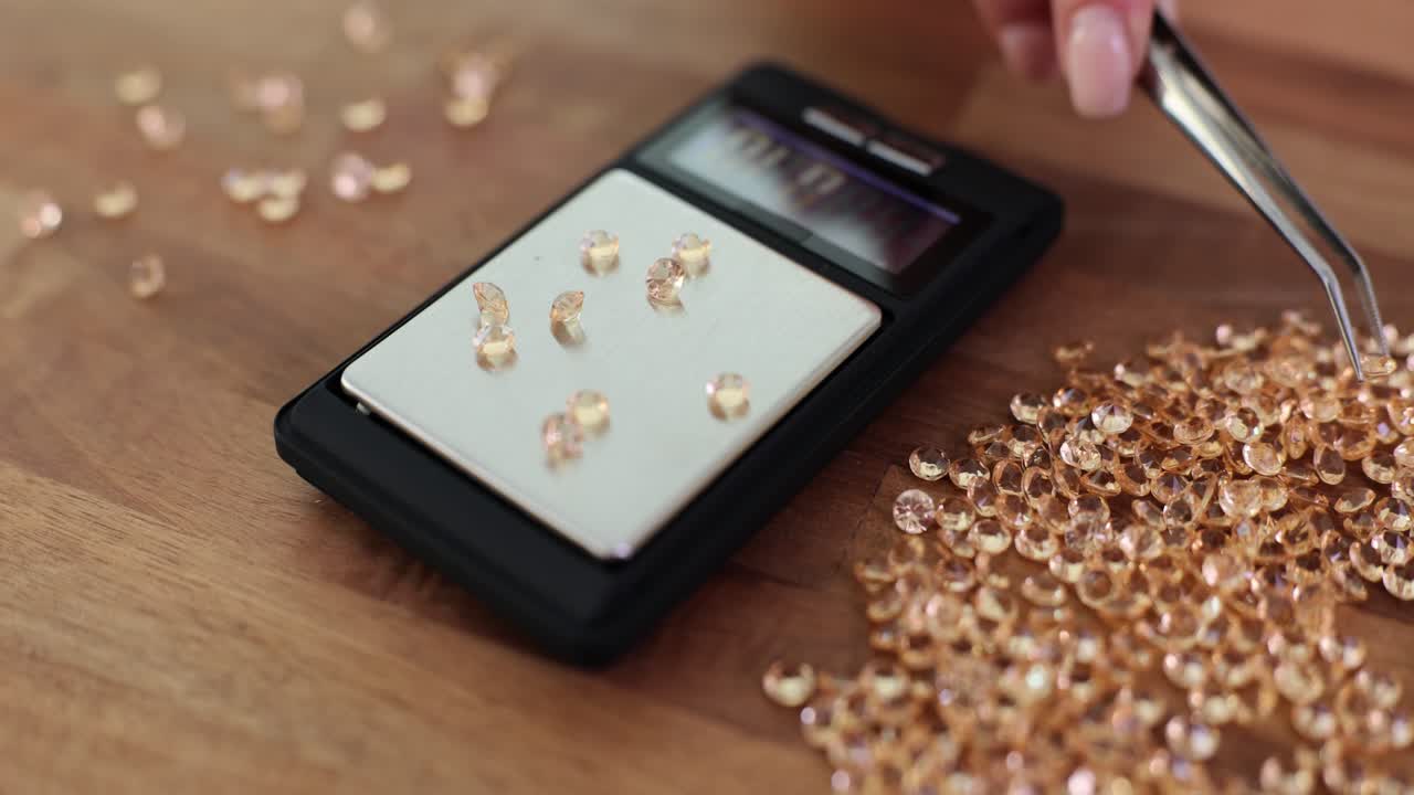 Weighing Precious Gems on a Digital Scale with Tweezers