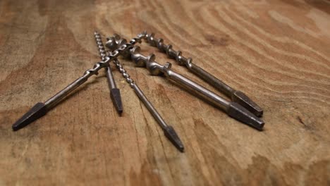 Old-screwbits-on-wooden-workshop-table