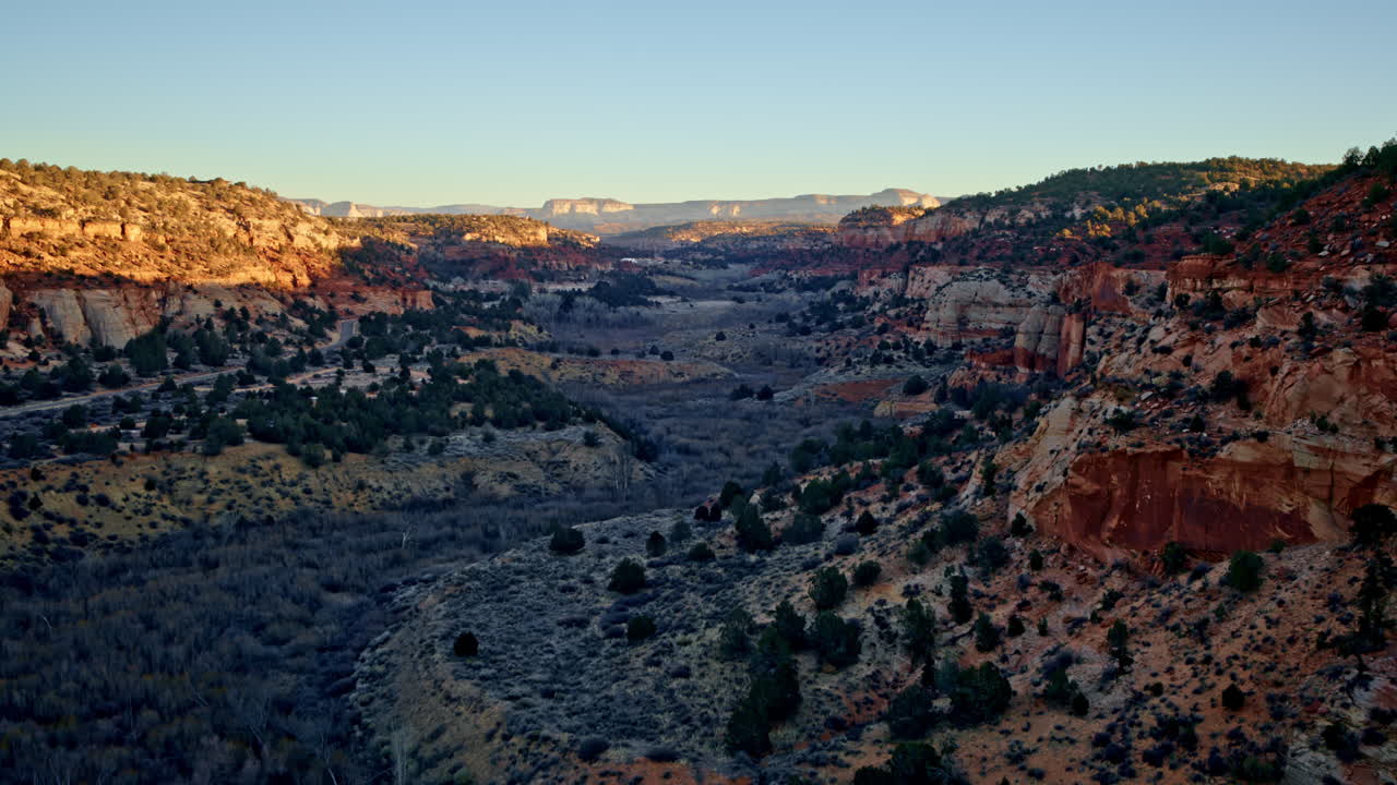 Aerial drone perspective showcasing the vast, rugged Canyonlands near Kanab at first light.