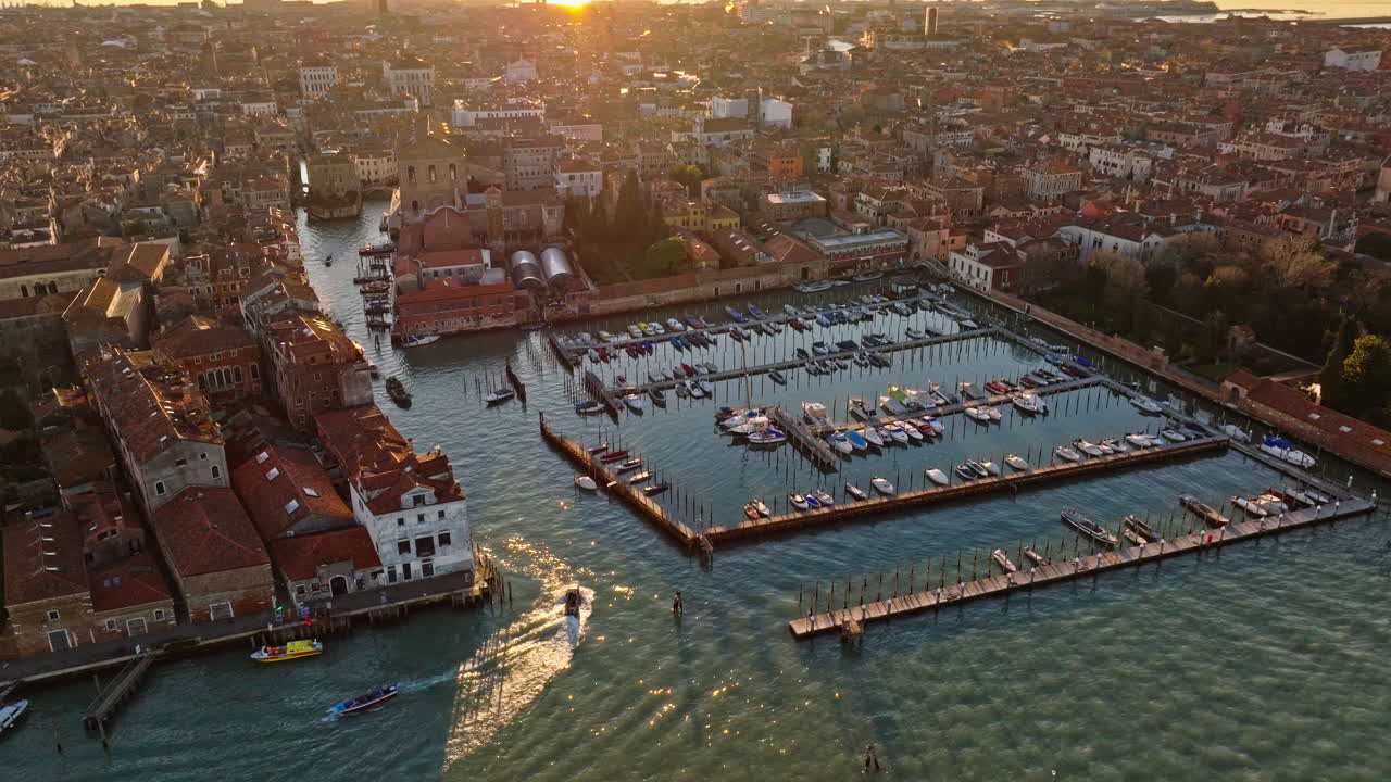 Aerial drone view of boats moving through Venice City, Italy