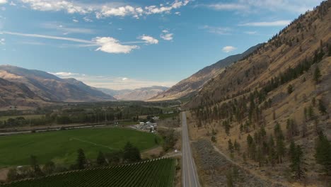 Aerial-View-of-Scenic-Road,-Hwy-3,-in-the-valley-around-the-Canadian-Mountain-Landscape