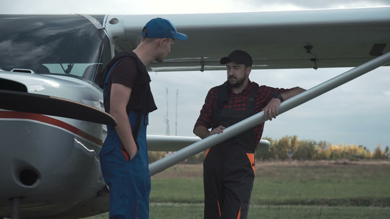 Airplane Maintenance Crew Discussing