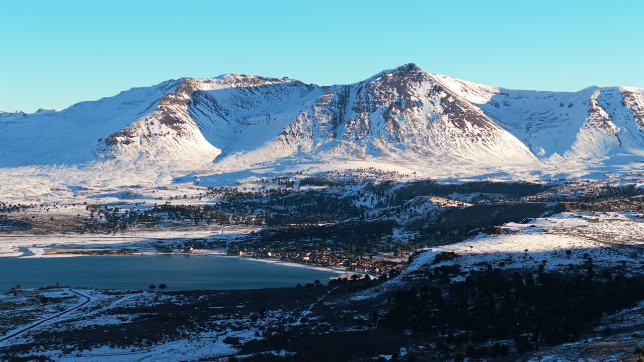 Beautiful Aerial Wide Panoramic View of Caviahue Snow Covered Mountain Range, Argentina